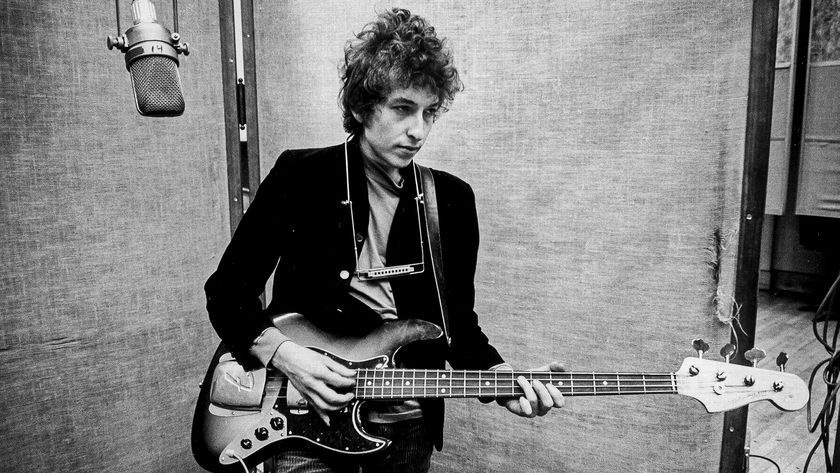 Bob Dylan plays a Fender Jazz bass with the harmonica around his neck while recording his album &#039;Bringing It All Back Home&#039; on January 13-15, 1965 in Columbia&#039;s Studio A in New York City, New York. 