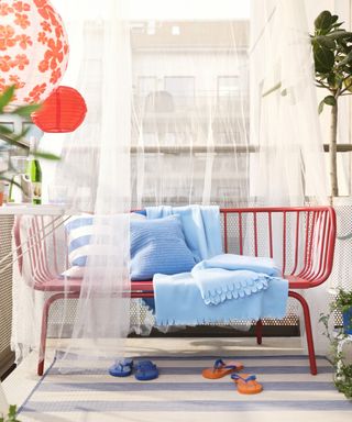 Five outdoor IKEA furniture pieces, red sofa