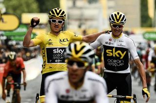 Geraint Thomas and Chris Froome celebrate Thomas' victory at the 2018 Tour de France