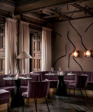 Dark purple seating in low lit restaurant