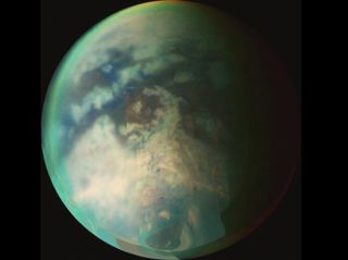 Titan's surface is difficult to see through the thick haze of the icy moon's nitrogen-rich atmosphere.