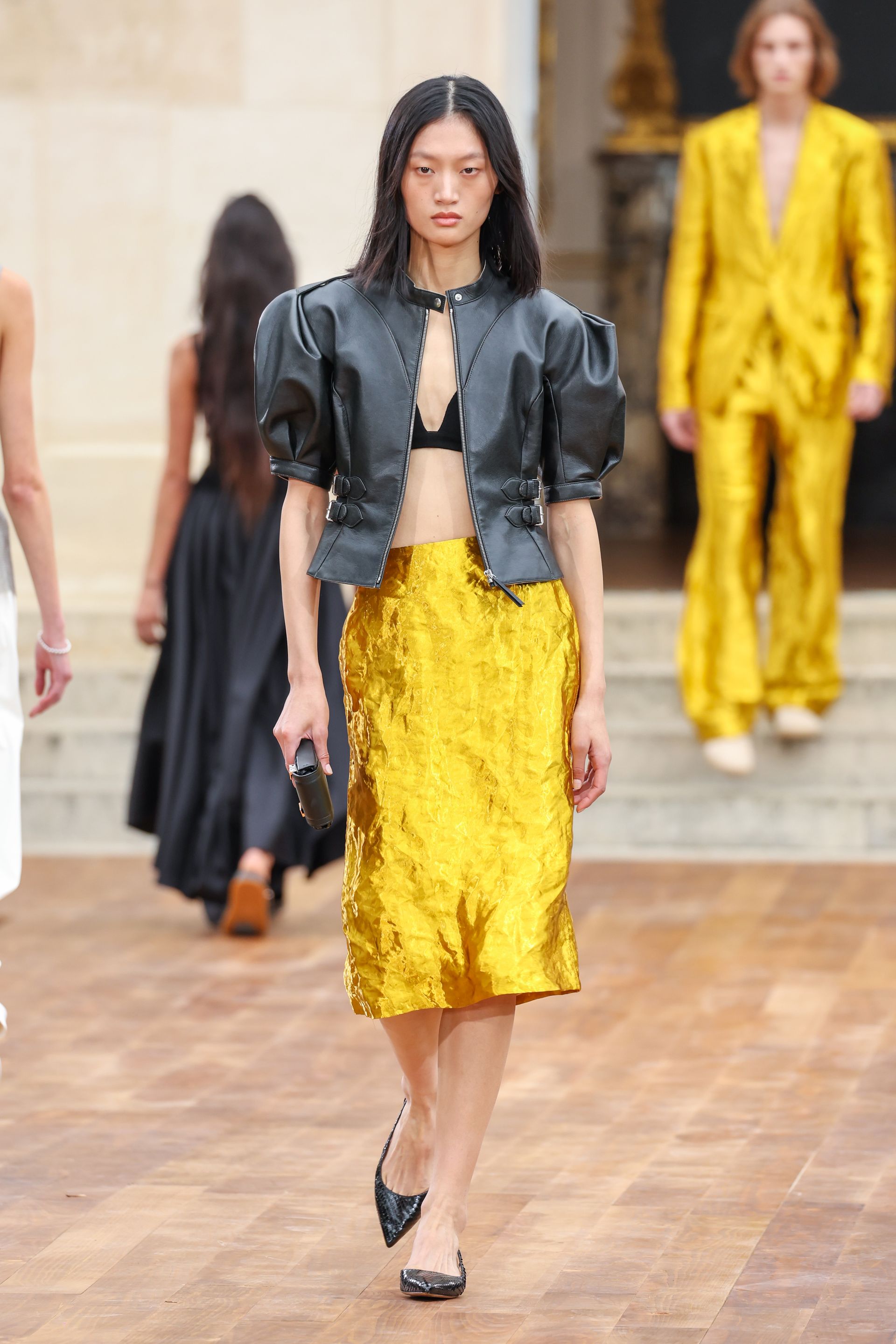 a runway model wears yellow