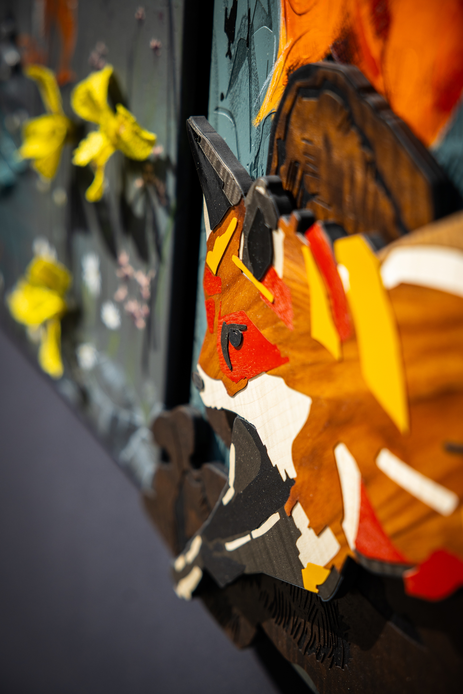Images of Rolls Royce craftspersons creating a triptych of nature scenes featuring a kingfisher