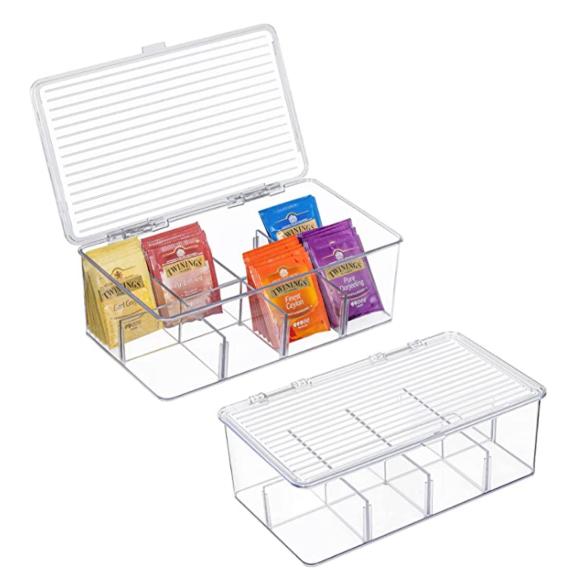 Dua wadah akrilik, satu dengan penjepit dan satu lagi dengan kantong teh