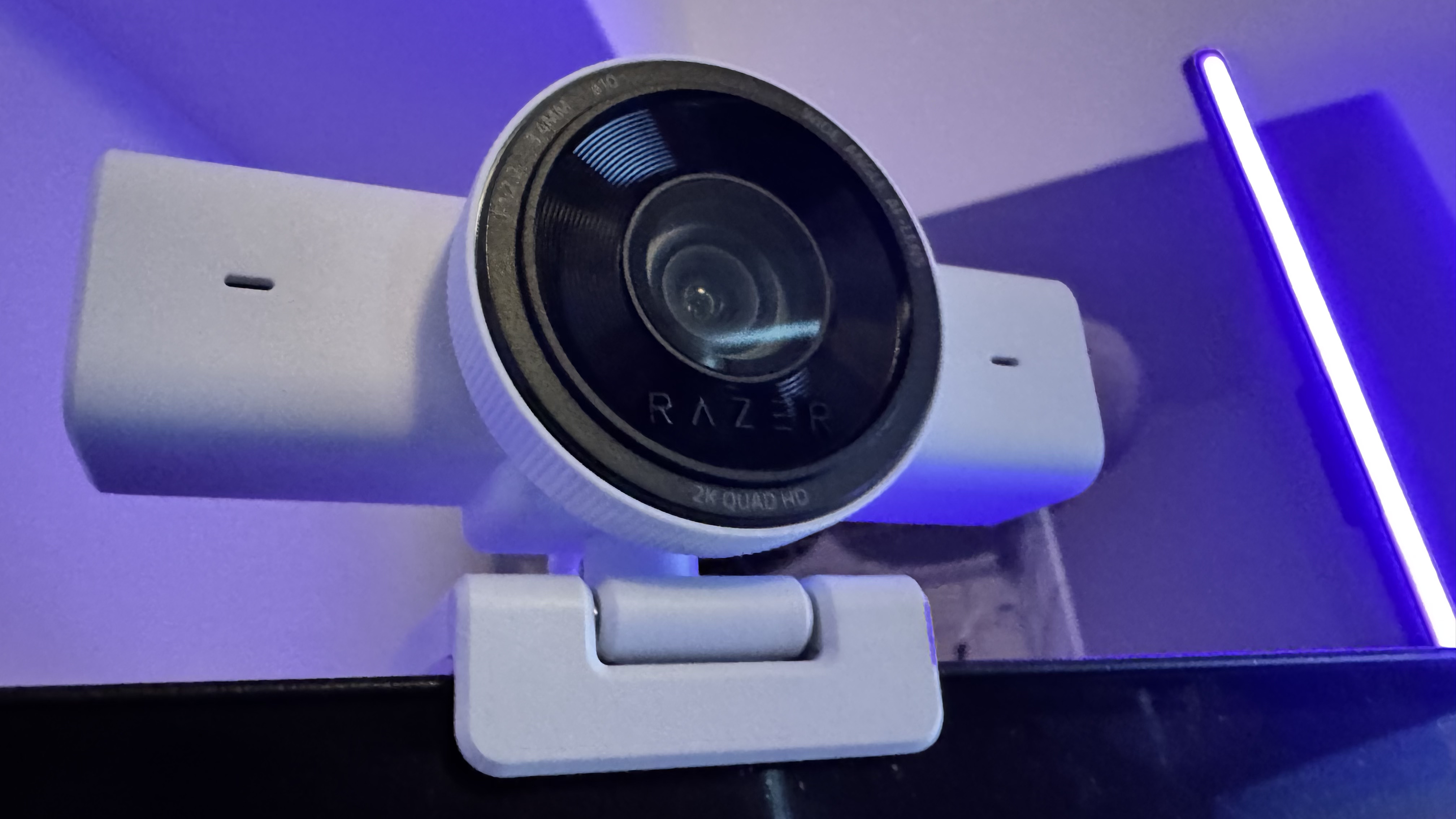 The Razer Kiyo V2 X webcam on top of a monitor from the left