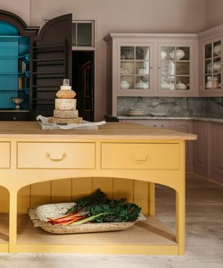 plain english kitchens yellow and pink kitchen with statement island and wall cabinets