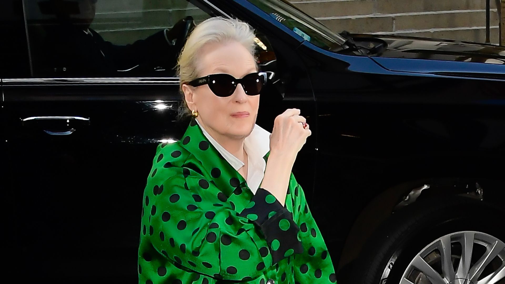 Meryl Streep in green polka dots and dark glasses