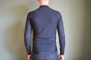 A male cyclist wearing a bloack Thermobooster base layer