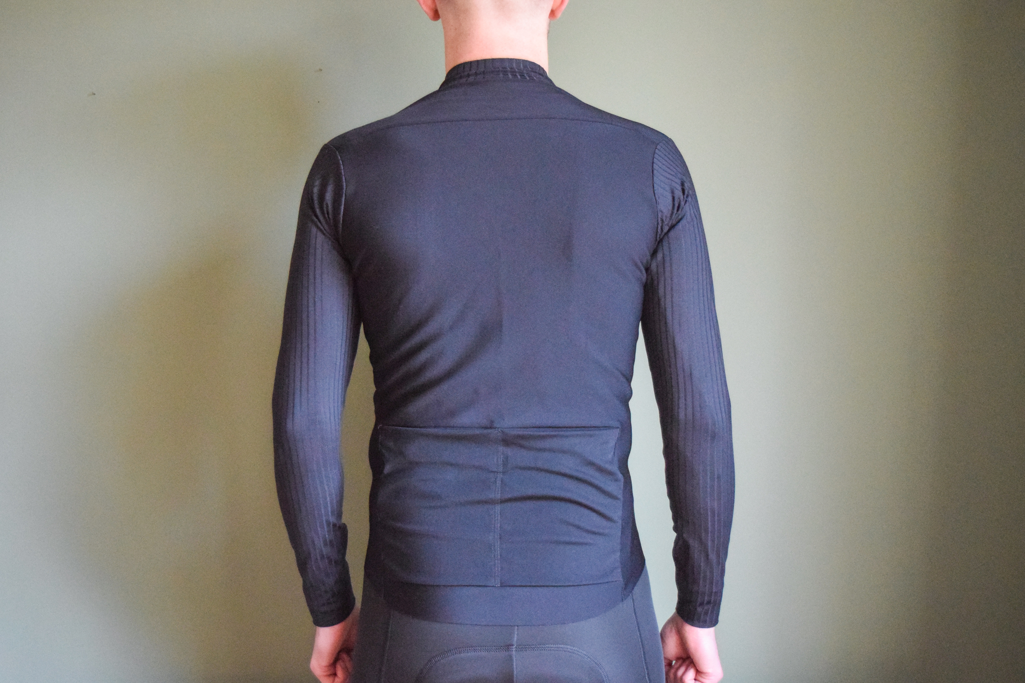 A male cyclist wearing a bloack Thermobooster base layer