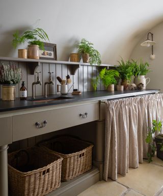 Utility room shelf styled with vintage ceramics