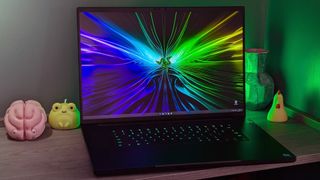 Razer Blade 18 (2024) gaming laptop open with Razer wallpaper