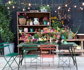 outdoor dining area decorated with cut flowers