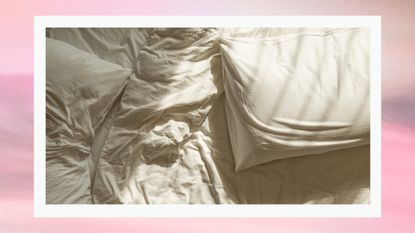 The speed bump sex position: a picture of two pillows in the middle of a bed, with white sheets and a white duvet/ in a pink and grey template 