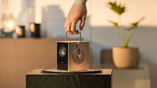 LG Cinebeam Q being held from its handle