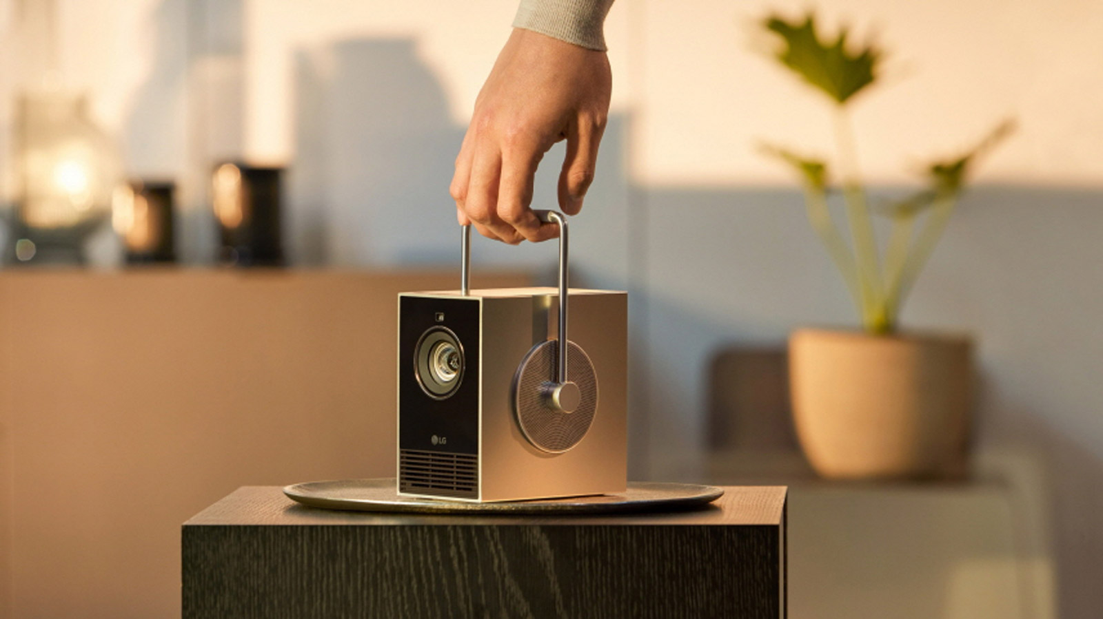 LG Cinebeam Q being held from its handle