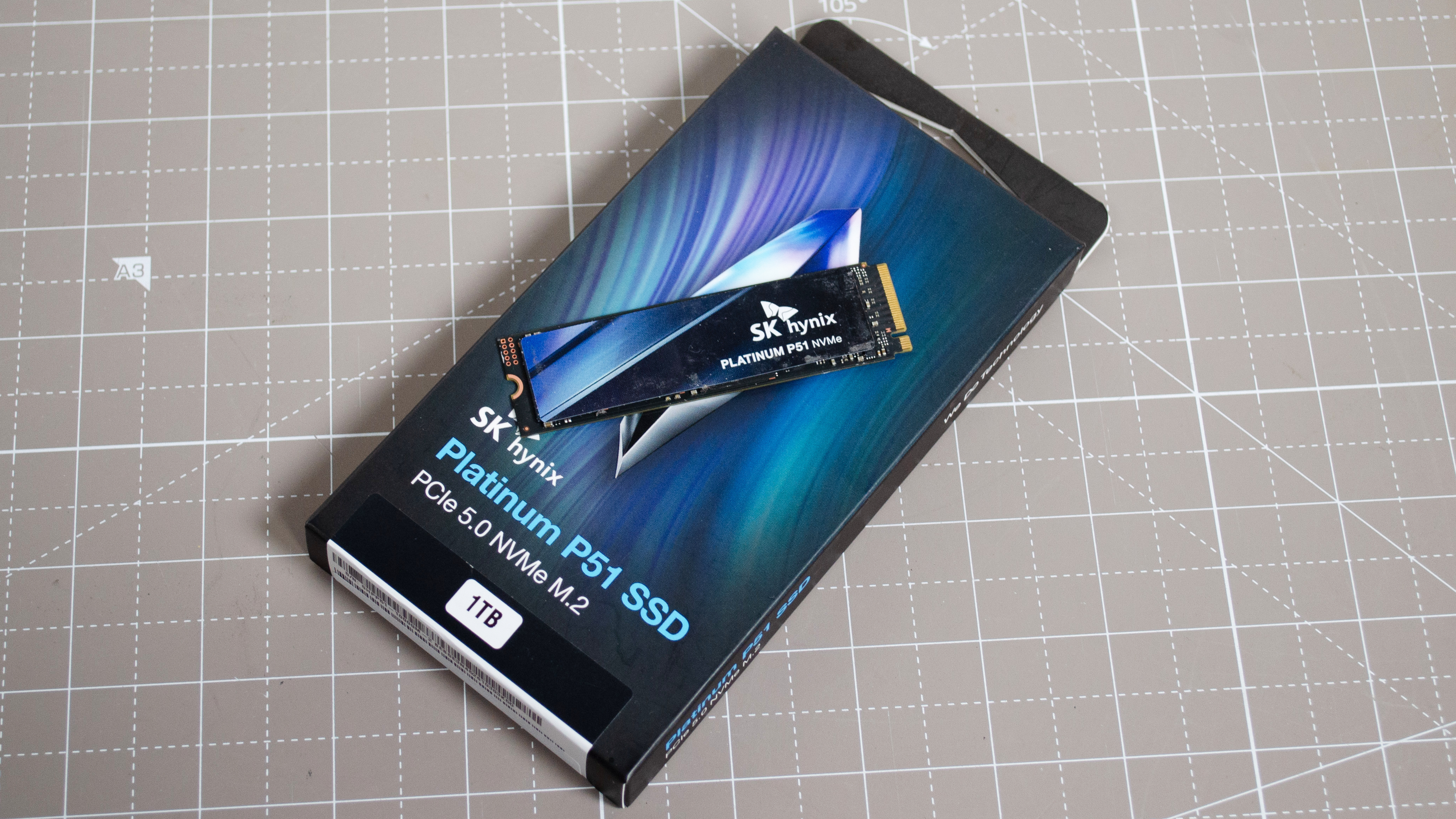 An sk hynix platinum p51 ssd resting on top of its retail packaging