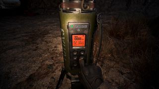 A screenshot showing Stalker 2's protagonist programming a scanner