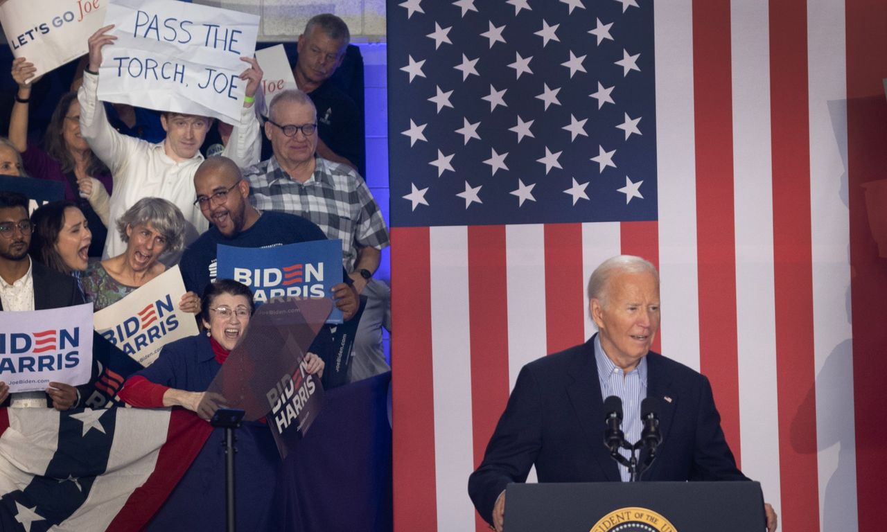 An audience member holds a sign calling on President Joe Biden to &quot;pass the torch&quot; during a campaign rally at Sherman Middle School on July 05, 2024 in Madison, Wisconsin