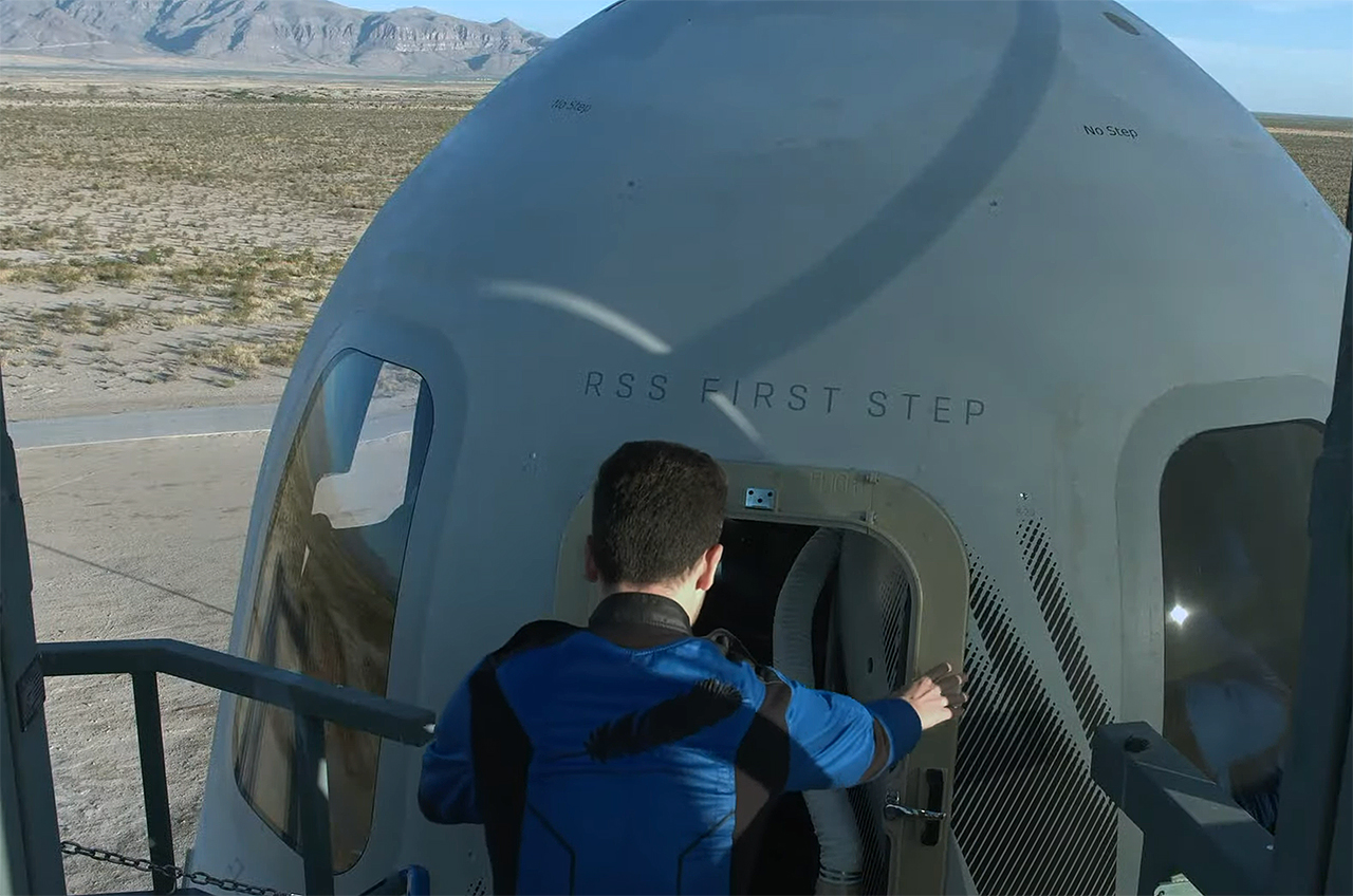 An NS-21 crew member boards Blue Origin's New Shepard 