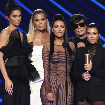 Kendall Jenner, Khloe Kardashian, Kim Kardashian, Kris Jenner, and Kourtney Kardashian onstage, and Prince Harry smiling, whom one of them was almost set up with