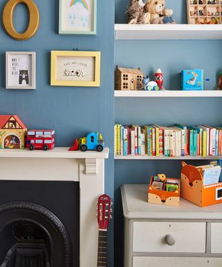 detail shot of alcove in childrens room with shelves and mixed wall art