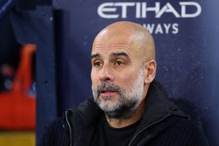 MANCHESTER, ENGLAND - DECEMBER 15: Josep 'Pep' Guardiola, manager of Manchester City, looks on during the Premier League match between Manchester City FC and Manchester United FC at Etihad Stadium on December 15, 2024 in Manchester, England. (Photo by Alex Livesey - Danehouse/Getty Images)