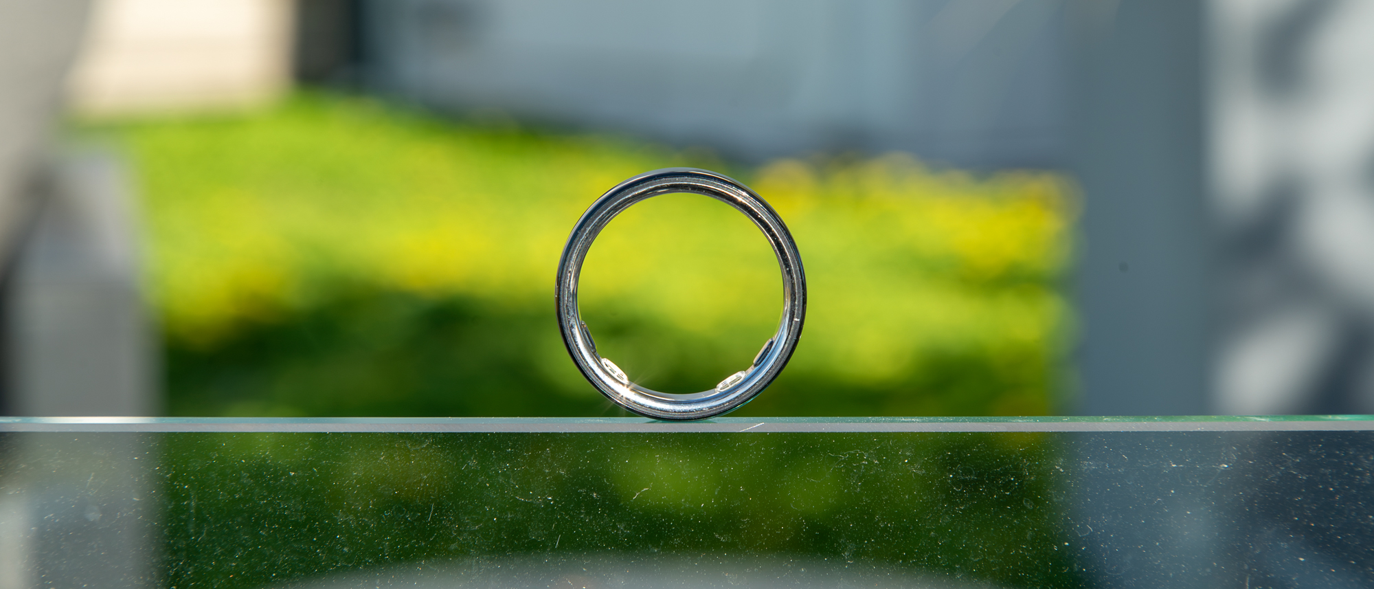 Oura Ring 5 on a glass panel
