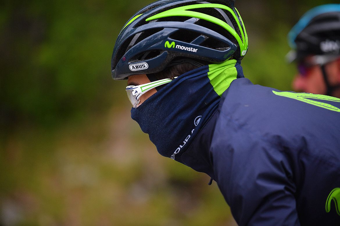 A Movistar rider bundled up against the cold in Switzerland