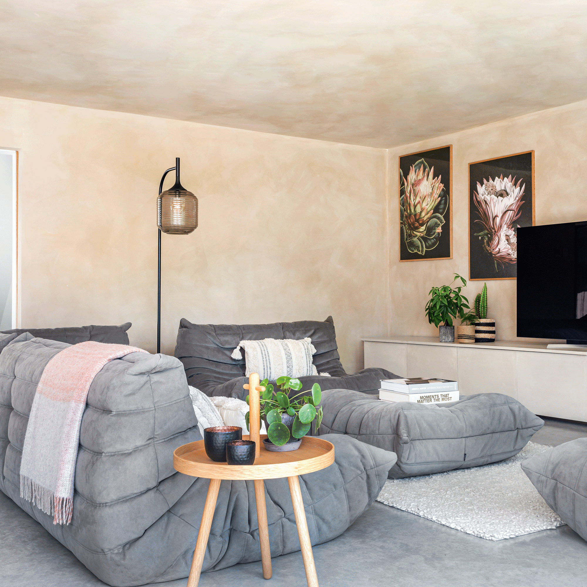 open plan living dining area with Ligne Roset sofa set in Grey