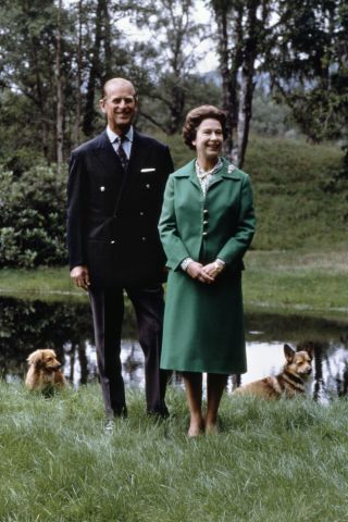 Picture dated 20 November 1979 of Queen Elizabeth II and Duke of Edinburgh posing with the royal corgies for their 32nd wedding anniversary in Balmoral Castle, Scotland.