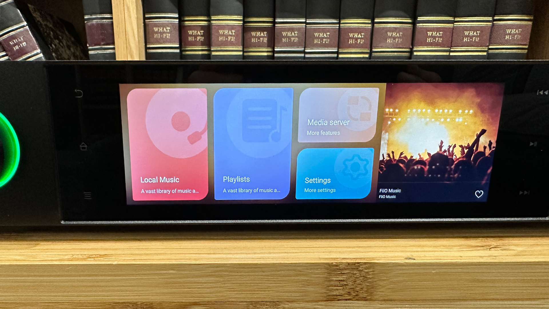 FiiO S15 music streamer detail of colour display in front of bookcase