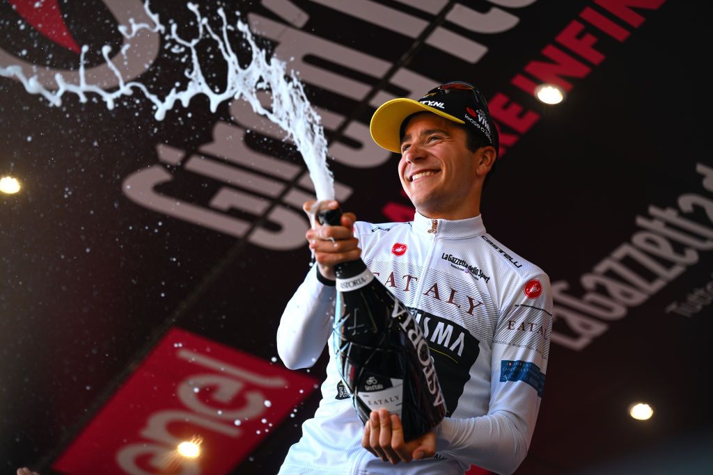 ANDORA ITALY MAY 07 Cian Uijtdebroeks of Belgium and Team Visma Lease a Bike White Best Young Jersey celebrates at podium during the 107th Giro dItalia 2024 Stage 4 a 190km stage from Acqui Terme to Andora UCIWT on May 07 2024 in Andora Italy Photo by Tim de WaeleGetty Images