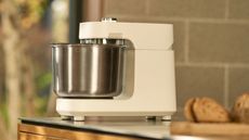 Ooni Halo Pro Spiral Mixer in polar white on a kitchen island