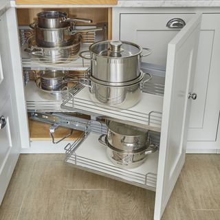 White corner kitchen cabinet for pans