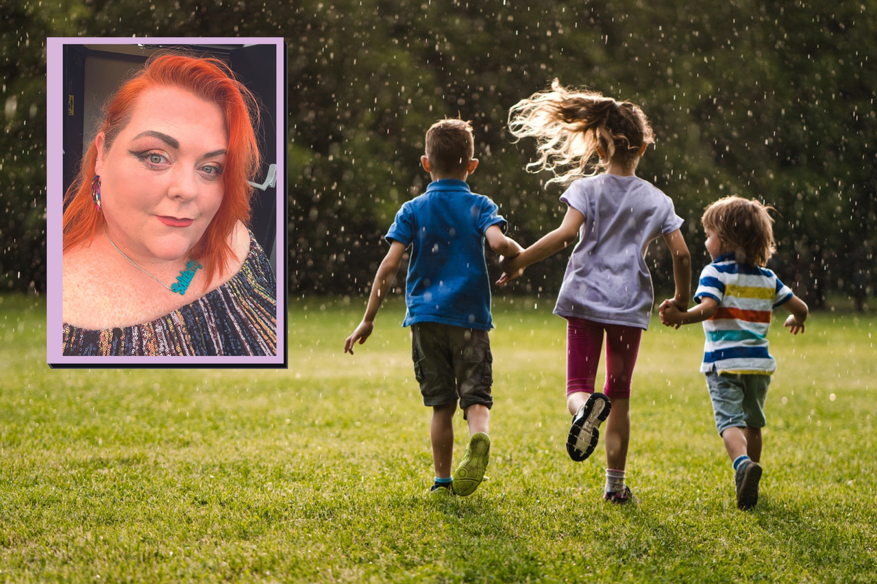 Mum and three children who are holding hands and running through the park