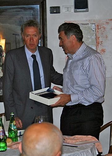 Valentino Campagnolo presents Eddy Merckx with a commemorative souvenir.