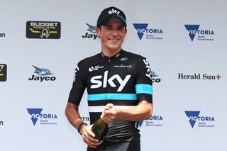 Stage winner Peter Kennaugh (Team Sky) pops the champagne