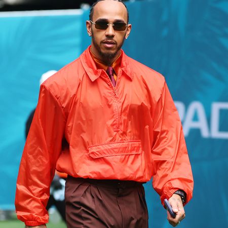 MIAMI, FLORIDA - APRIL 30: Lewis Hamilton of Great Britain and Scuderia Ferrari arrives in the Paddock during previews ahead of the F1 Grand Prix of Miami at Miami International Autodrome on April 30, 2026 in Miami, Florida. 