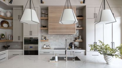 kitchen island with steel sink and taps