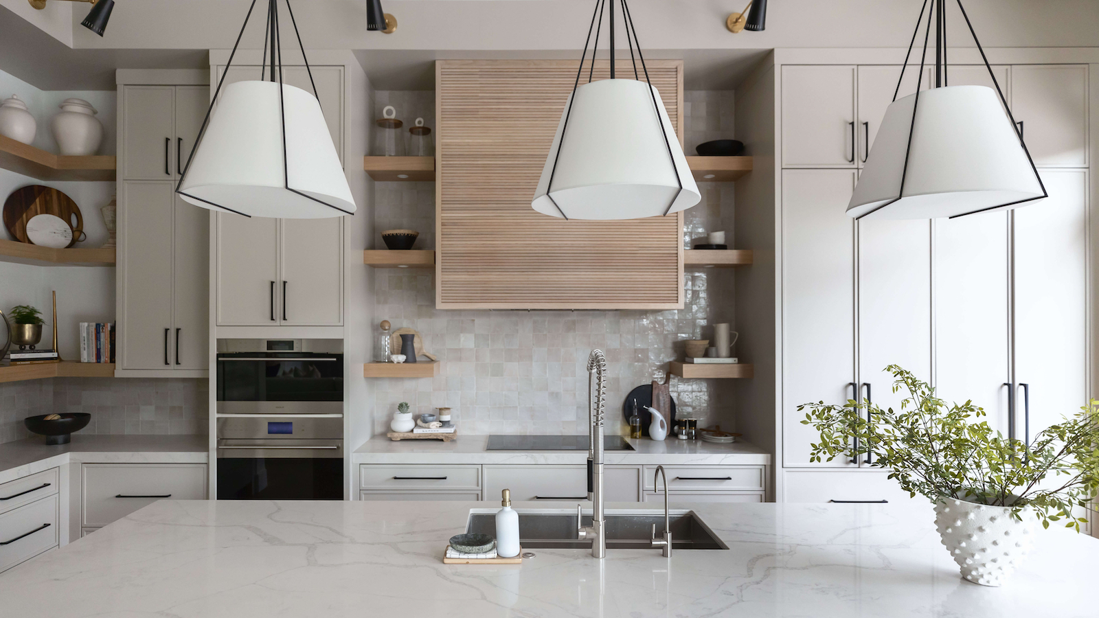 kitchen island with steel sink and taps