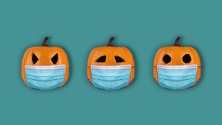 Halloween pumpkins wearing protective face masks