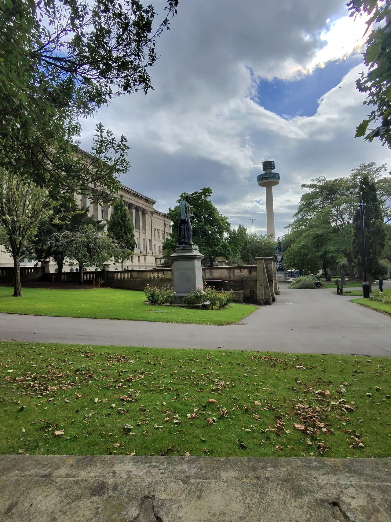 Image taken with the Ray-Ban Meta smart glasses showing a park with a statue and a tower in the background.
