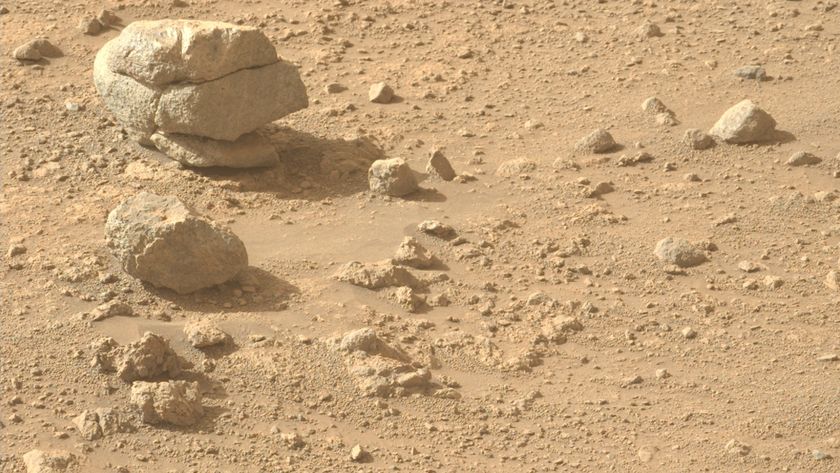 a large stone is cracked in such a way as to appear like three stones stacked on one another