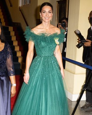Kate Middleton wearing a green off the shoulder gown