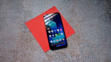 Google Pixel 9a home page against red background
