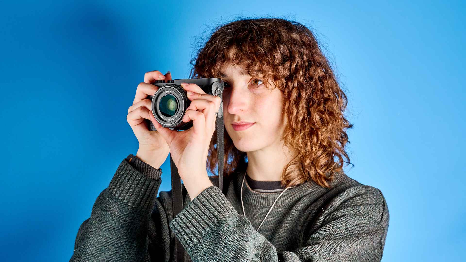 A black Leica Q3 Monochrom black-and-white mirrorless camera