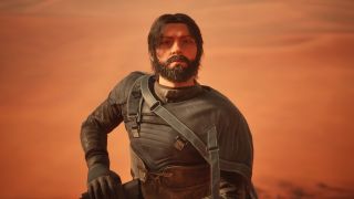Dune: Awakening Holtzman Amplifier location - A close-up of a masculine character wearing a stillsuit kneeling and looking upwards slightly.
