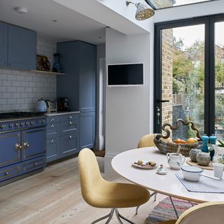 kitchen with dining area with wooden flooring