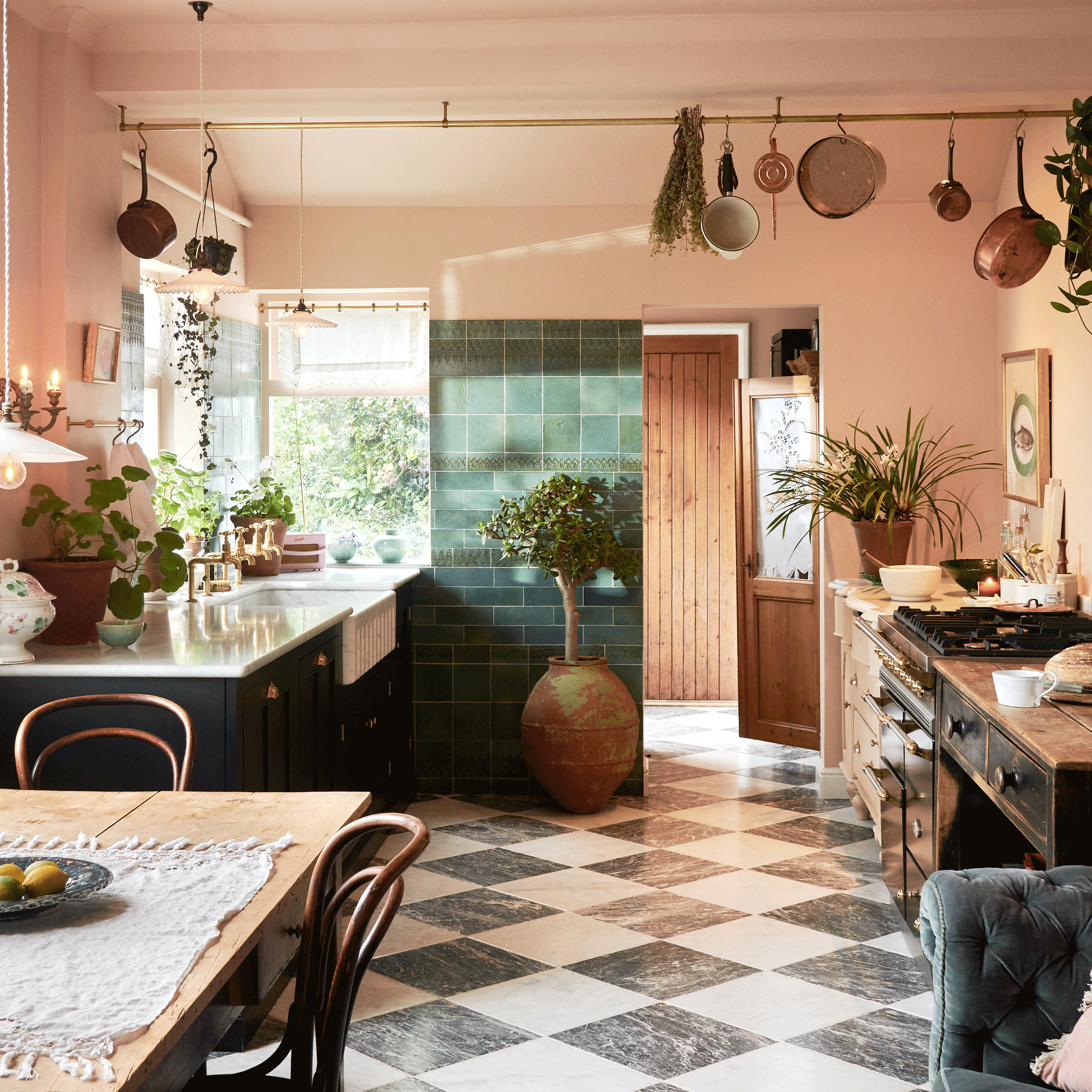 pink kitchen with chequerboard floor