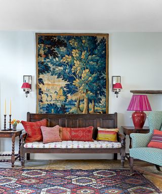 colorful hall with Verdure tapestry, antique kilim and wooden bench